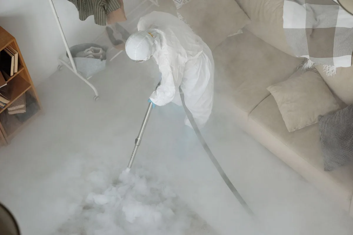 Biohazard cleanup technician in protective equipment, Wellswood, Tampa, FL